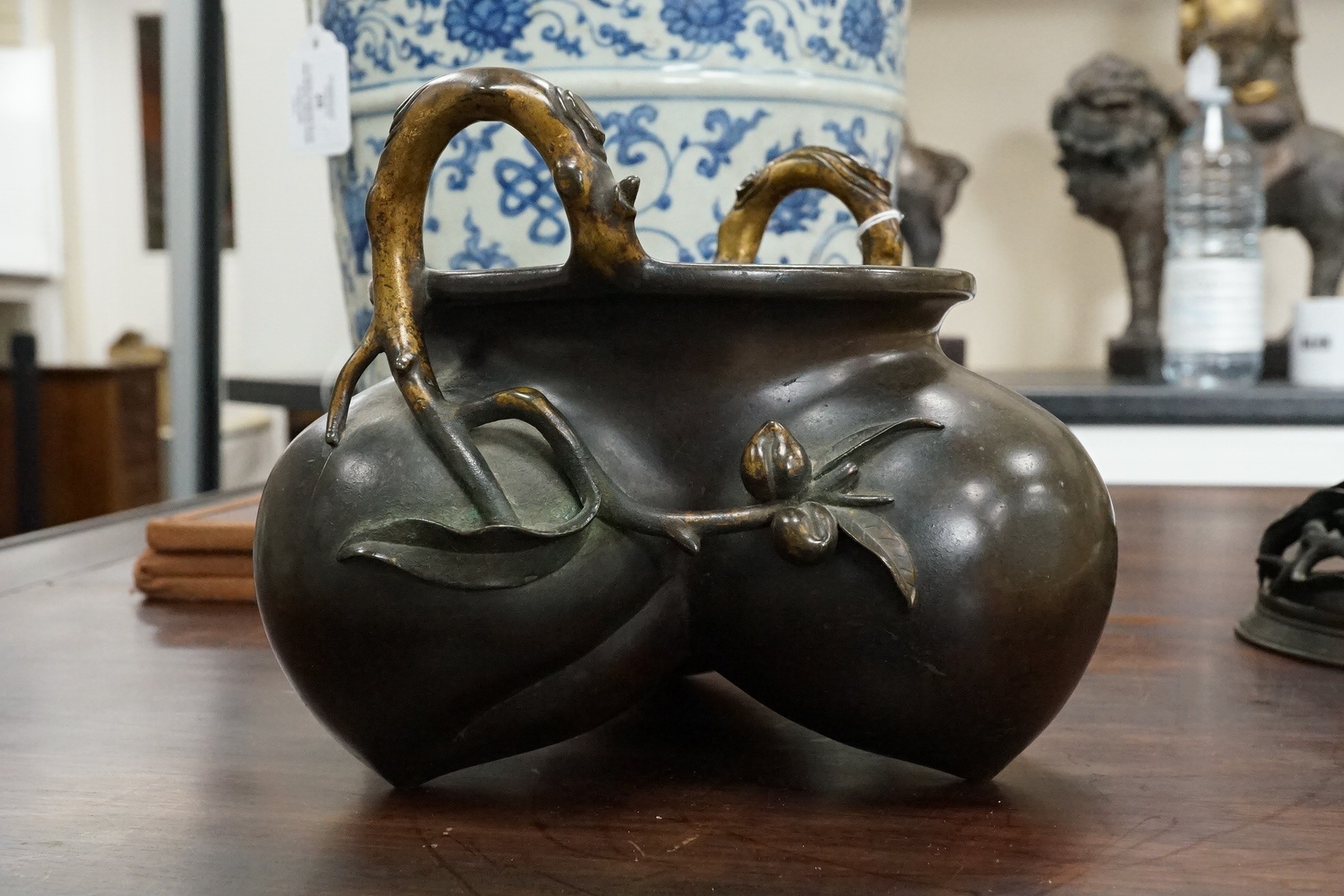 A large Chinese bronze and parcel gilt ‘peach’ censer and cover, Li, 17th/18th century